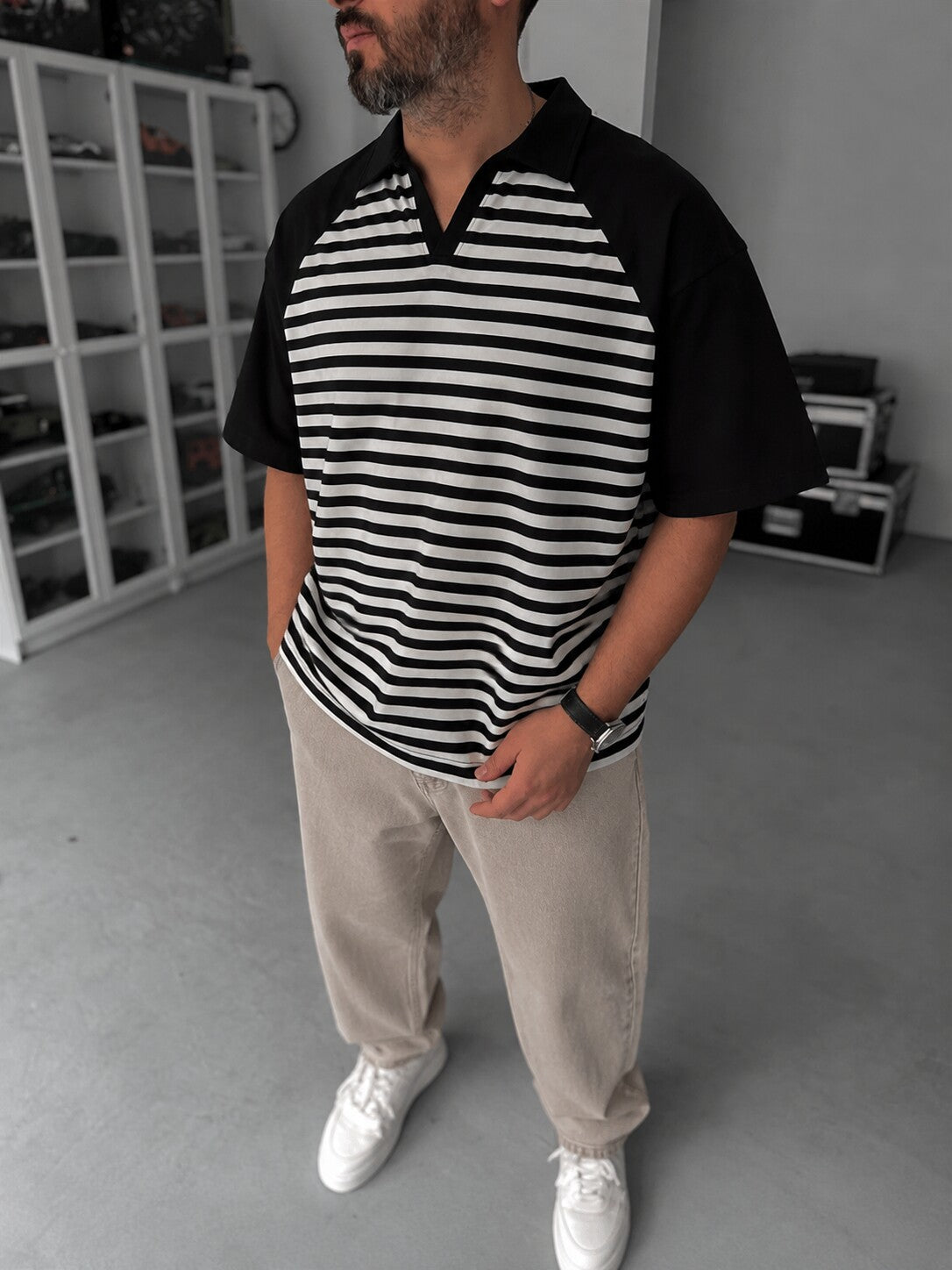 Men's Vintage Striped Polo in black and off-white - lifestyle view