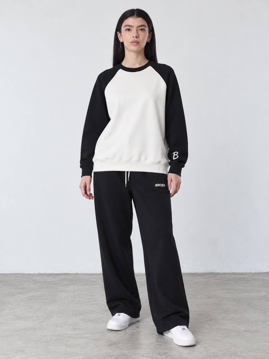CC02 full outfit, crewneck fully untucked, female model wearing M