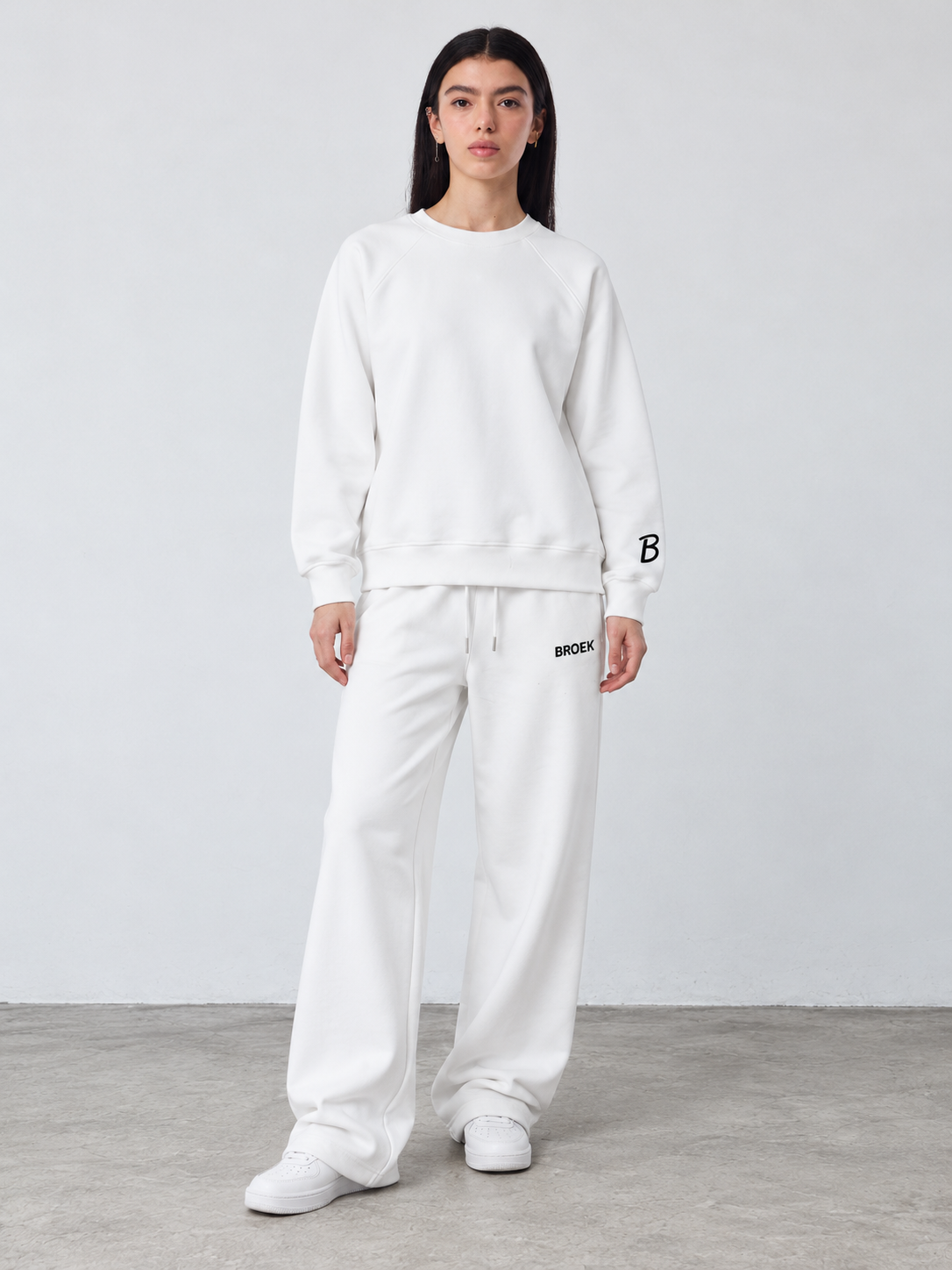 CS05 full outfit, crewneck fully untucked, female model wearing M