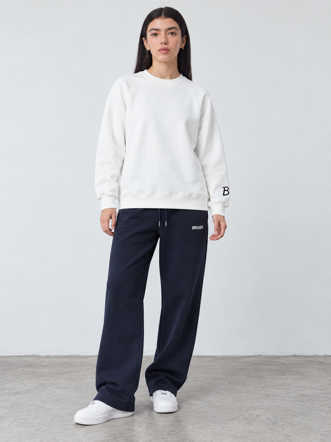 CS05 full outfit, crewneck fully untucked, female model wearing M