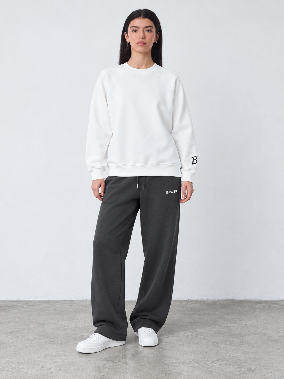 CS05 full outfit, crewneck fully untucked, female model wearing M