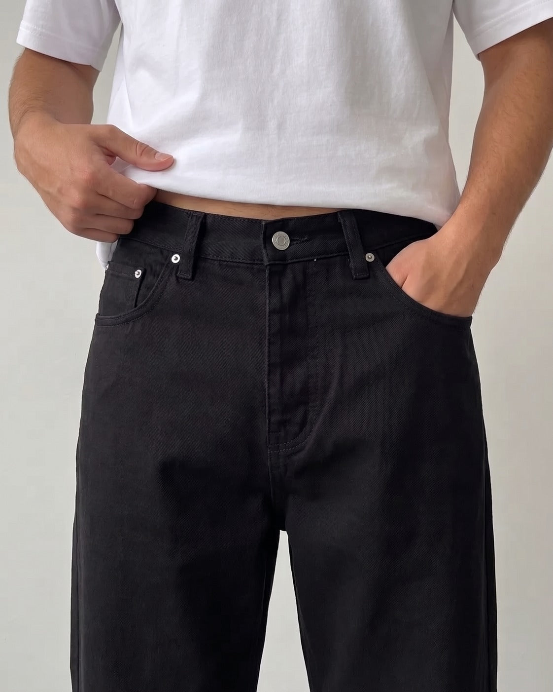 BROEK jet black relaxed fit denim jeans - waistband and silver button detail