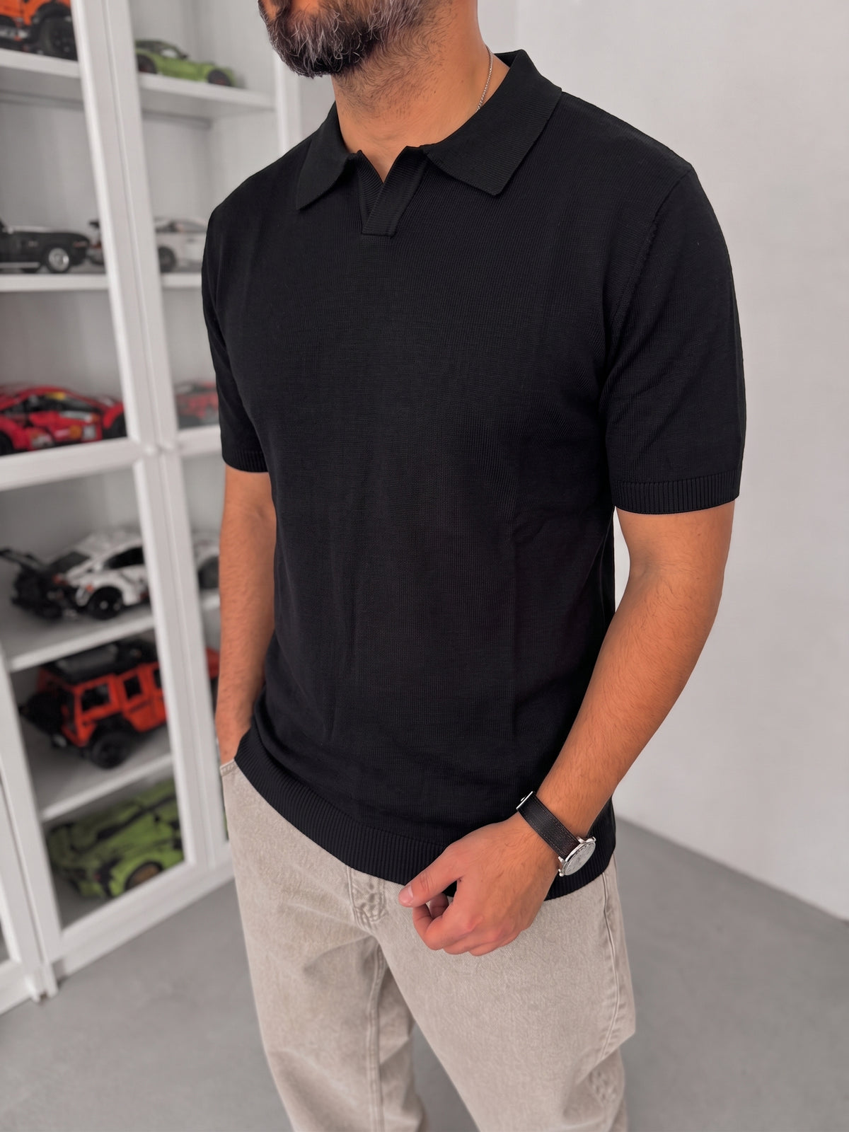 Men's black knitted polo T-shirt — fabric and fit detail
