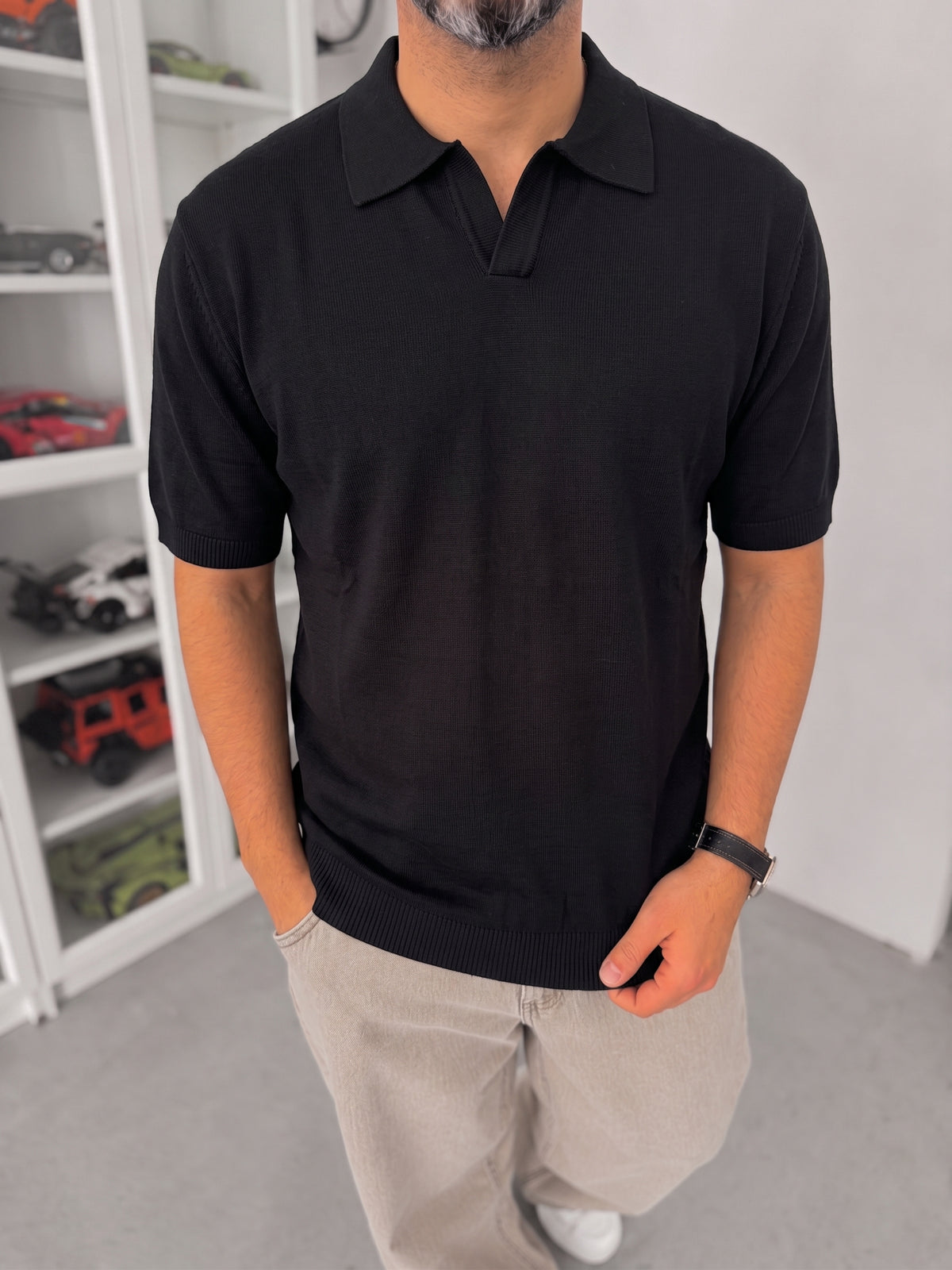 Men's black knitted polo T-shirt — full outfit view