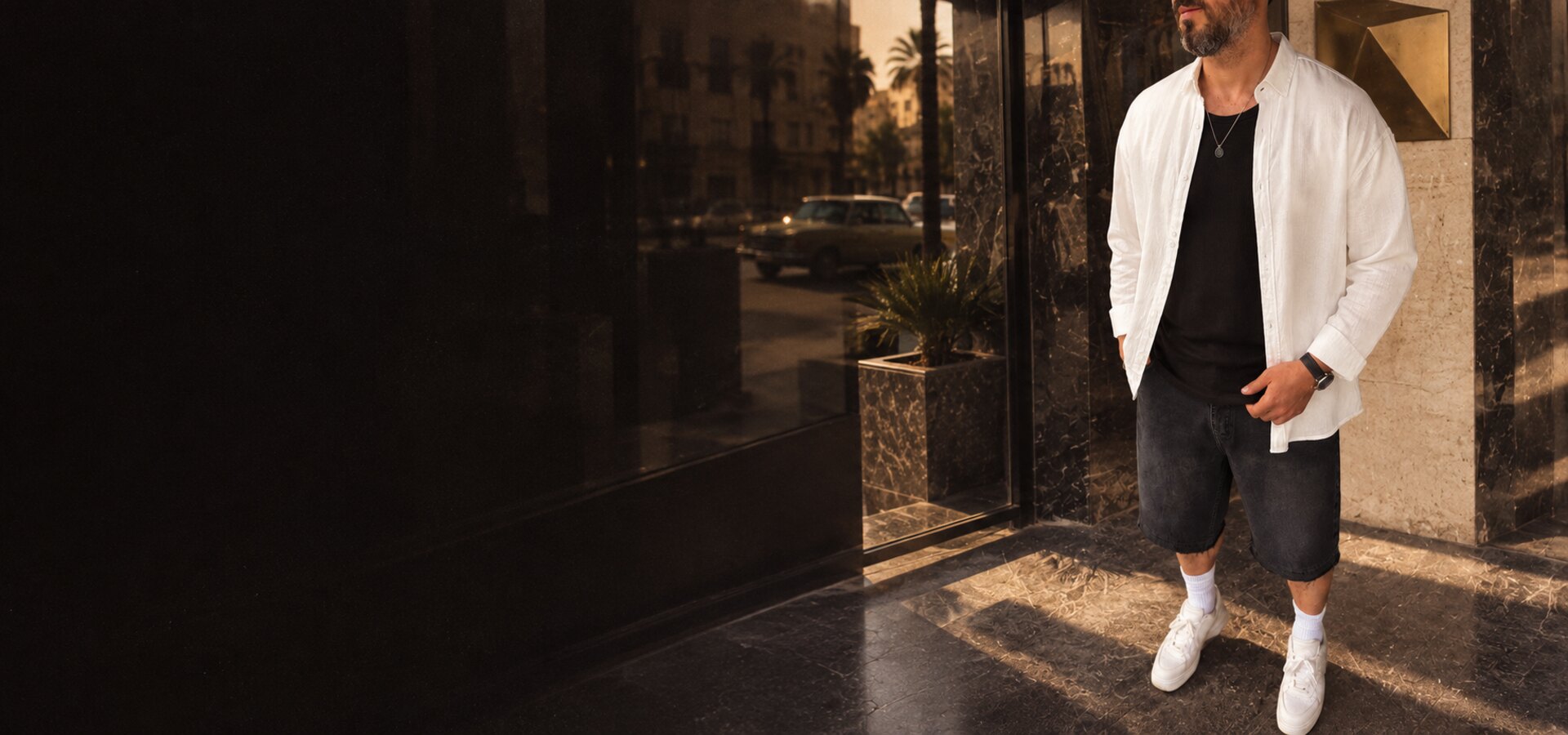 BROEK 80s Cairo edit with off-white linen shirt, black ribbed tank and black denim shorts