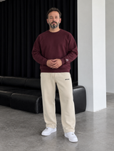 Boxy Sweatsuit – Burgundy / Beige — full outfit, front view on male model.