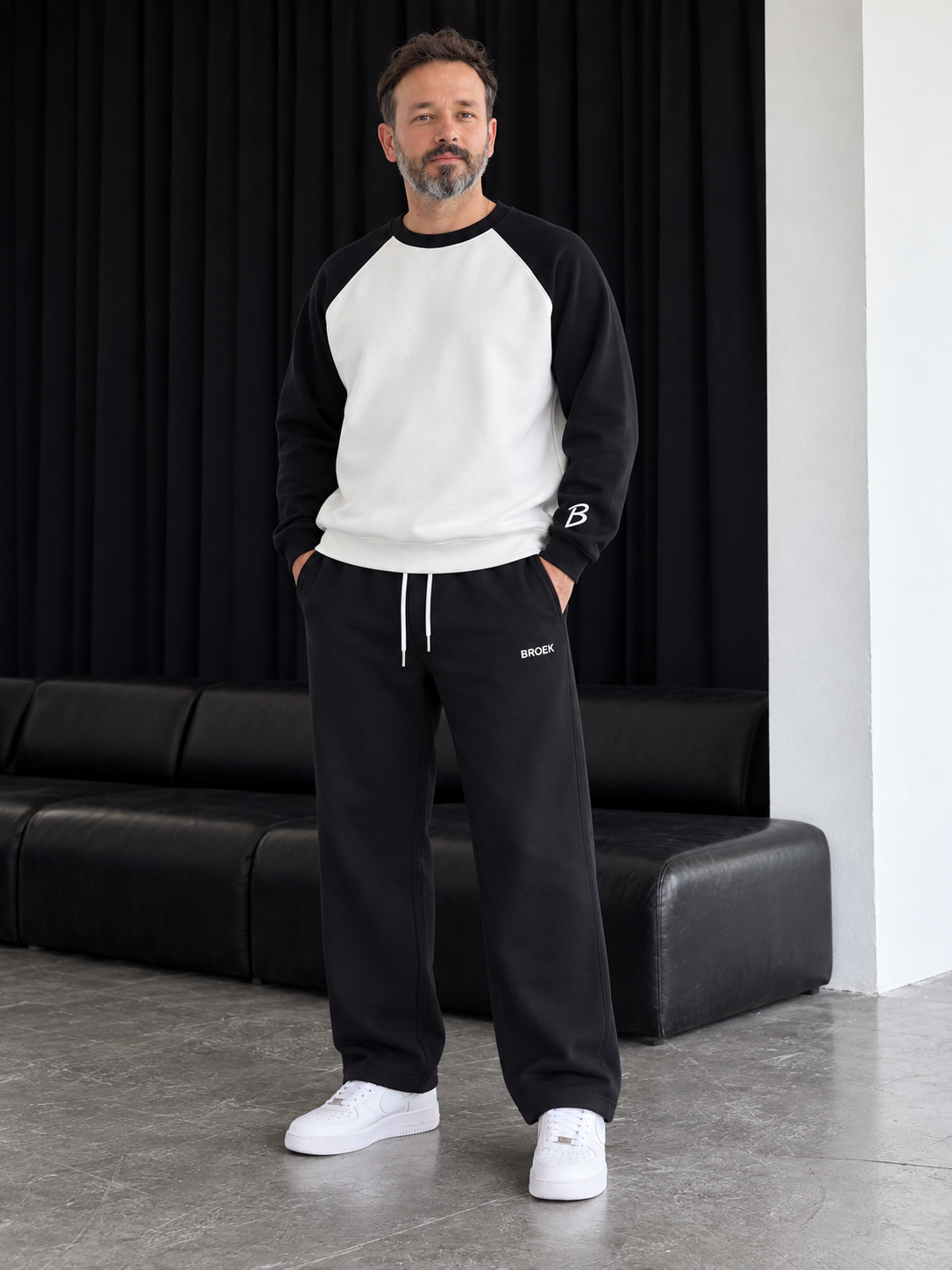 Two-Tone Boxy Sweatsuit – White & Black / Black — full outfit, front view on male model.