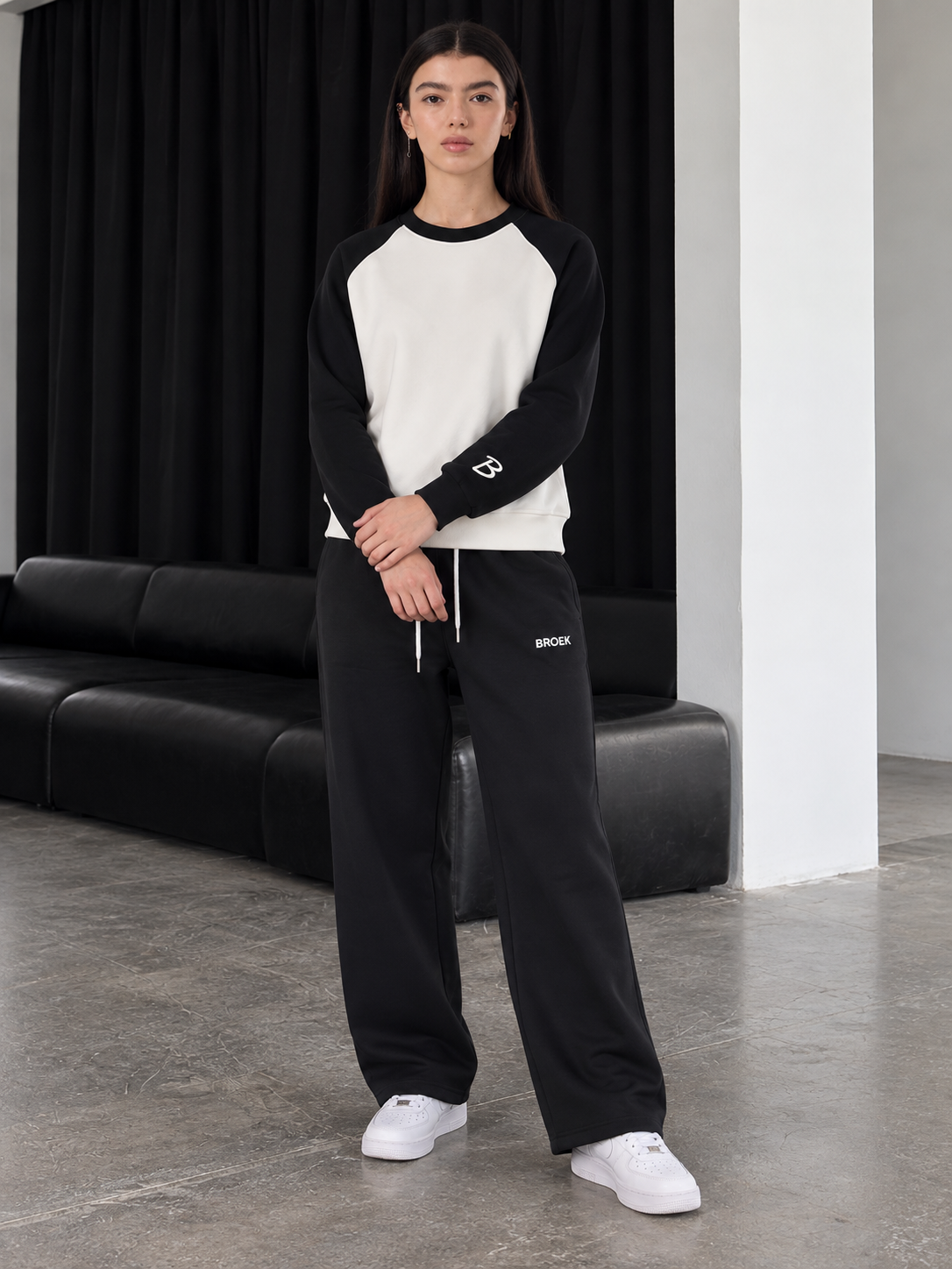 Two-Tone Boxy Sweatsuit – White & Black / Black — full outfit, front view on female model.