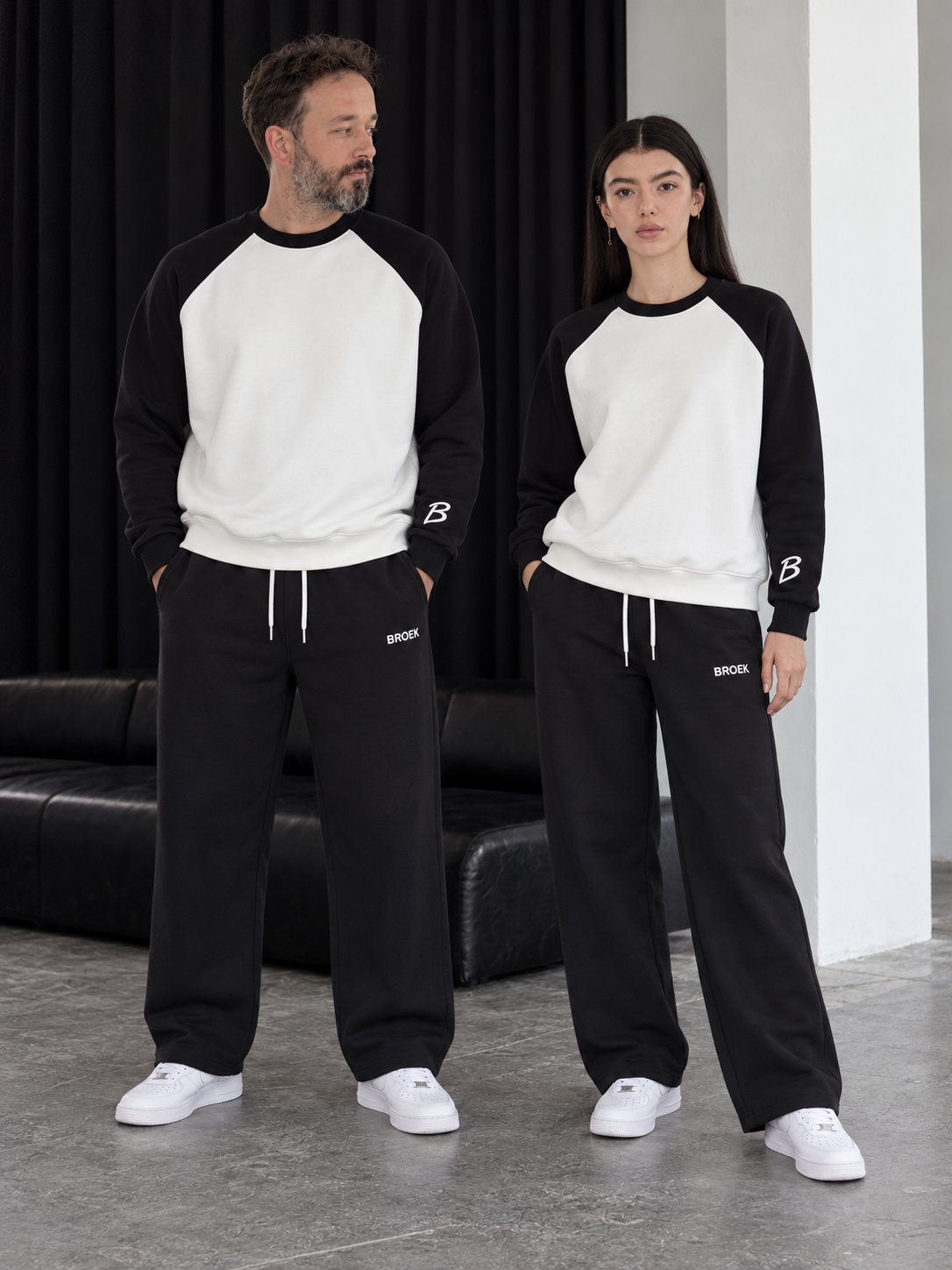 Two-Tone Boxy Sweatsuit – White & Black / Black — full outfit on male and female models.
