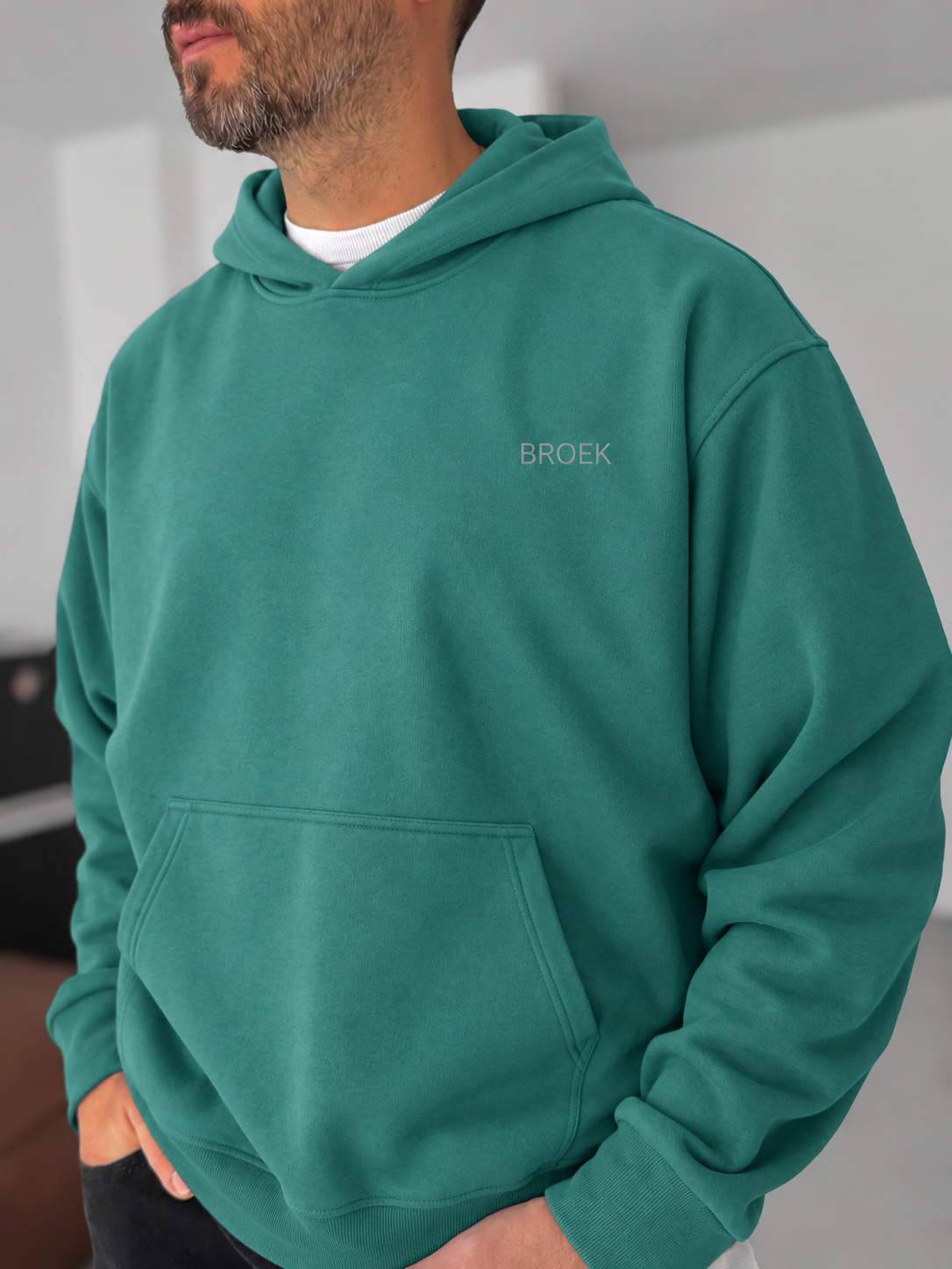 BROEK Olive Green oversized hoodie — chest logo and kangaroo pocket detail