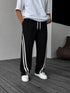 Double Stripe Relaxed Pants in black, front view