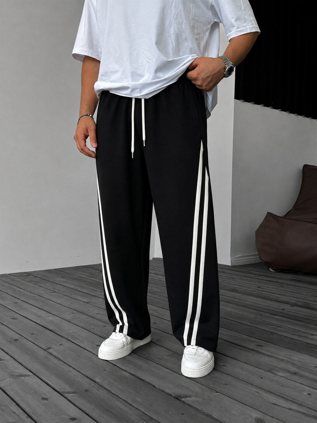 Double Stripe Relaxed Pants in black, side view