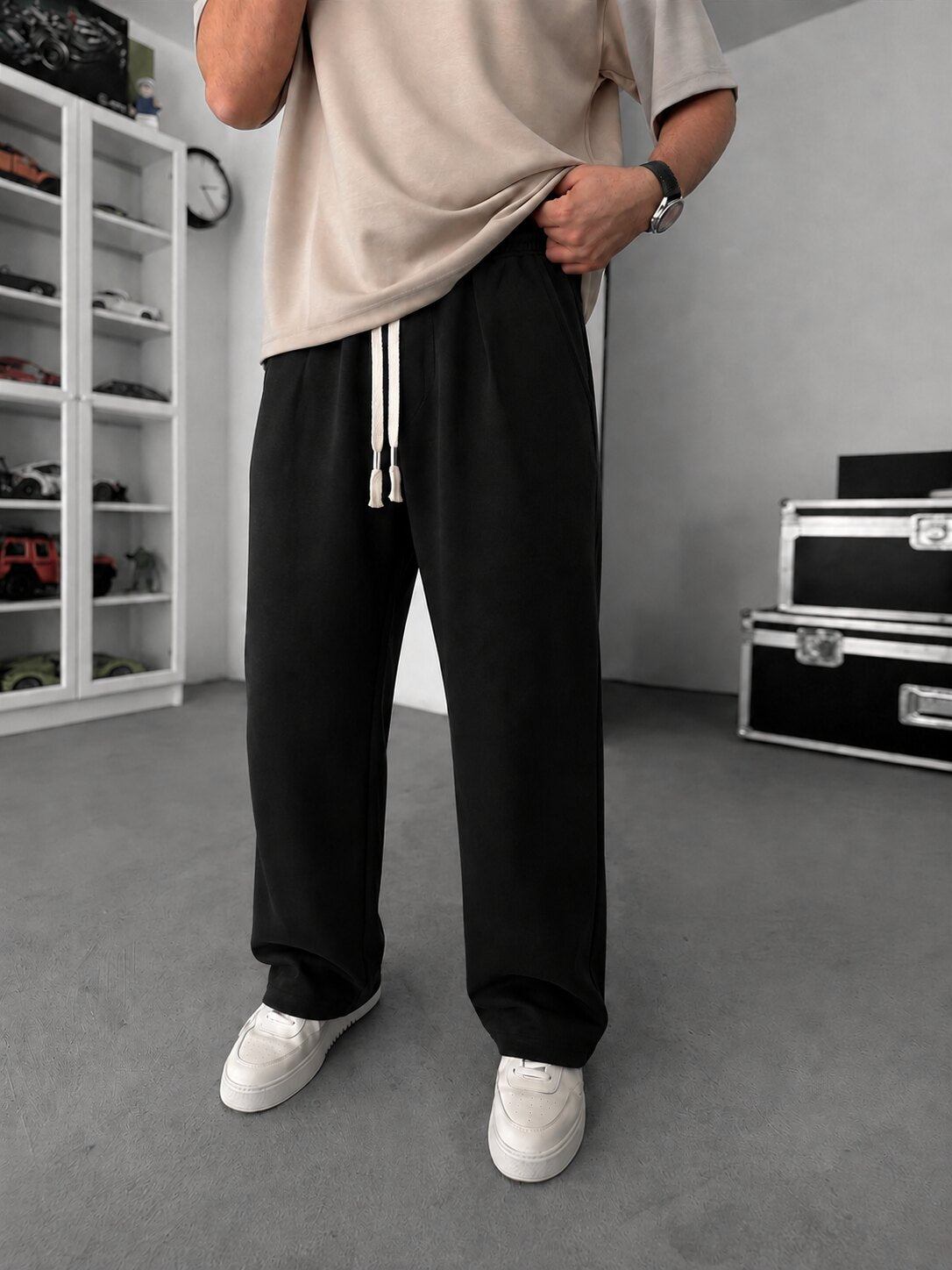 Pleated Relaxed Sweatpants in black, full front view