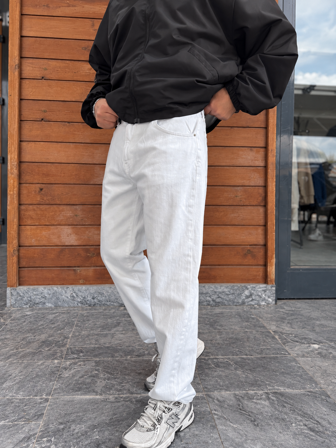 White Relaxed Fit Denim Jeans by BROEK, angled front view